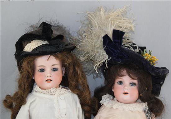 An Armand Marseille bisque headed doll & another similar